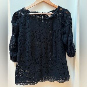 Sundance Black Lace Top with feminine charm. Size Medium (8-10).